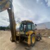 RetroPala, Marca: NEW HOLLAND, Modelo: LB 110, Año fabricación 2001, equipada con dos cazos y matriculada.