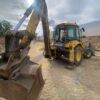 RetroPala, Marca: NEW HOLLAND, Modelo: LB 110, Año fabricación 2001, equipada con dos cazos y matriculada.