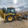 RetroPala, Marca: NEW HOLLAND, Modelo: LB 110, Año fabricación 2001, equipada con dos cazos y matriculada.