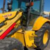 Retro Pala, Marca: NEW HOLLAND, Modelo: B 110 , Año fabricación 2003, Horas: 20.000 Aprox, equipada con dos cazos, 40 y limpieza, Horquillas portapalet, pala de almeja, brazo telescópico, mandos pilotados, matriculada. Maquinaria lista para trabajar.
