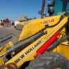 Retro Pala, Marca: NEW HOLLAND, Modelo: B 110 , Año fabricación 2003, Horas: 20.000 Aprox, equipada con dos cazos, 40 y limpieza, Horquillas portapalet, pala de almeja, brazo telescópico, mandos pilotados, matriculada. Maquinaria lista para trabajar.